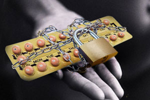 Credit Card Wrapped in Chains and Padlocked --- Image by © Royalty-Free/Corbis